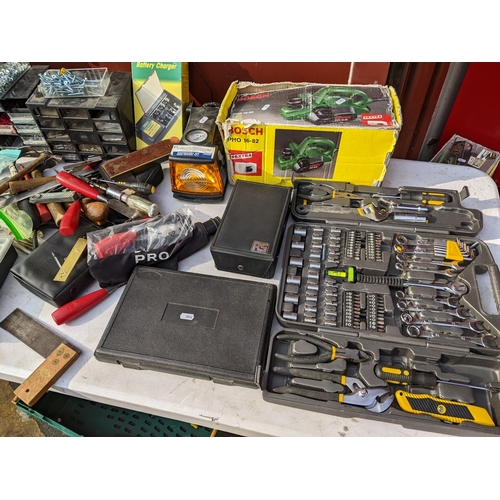 192 - Mixed tools to include a Rapid Racking tool kit, Bosch 16.82 planer, nuts and bolts, battery charger... 