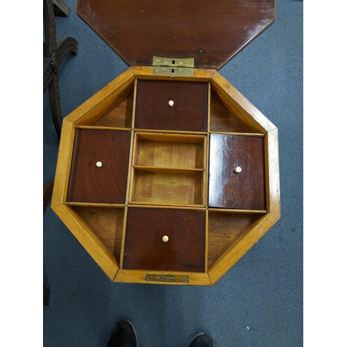 2 - A 19th century mahogany sewing table having an octagonal hinged top and on lion paw feet, 77cm h x 4... 