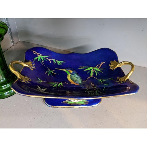 28 - An early 20th century Carlton ware lustre glazed twin handled fruit bowl and a Bohemian green glass ... 