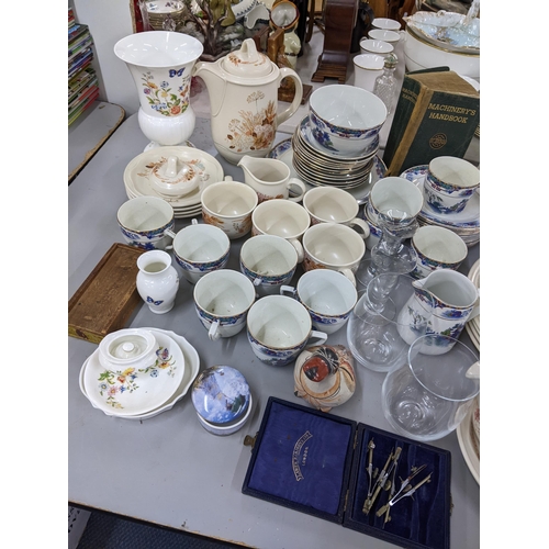 30 - A mixed lot to include Poole Summer Glory, vintage tins, Palissy tea service, books, lighters, and o... 