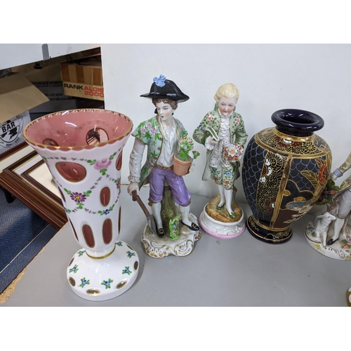 68 - Four porcelain figures to include two 19th century Sitzendorf figures, together with a Bohemian pain... 