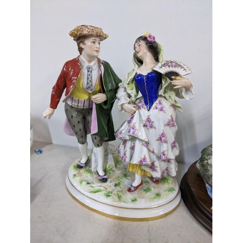 73 - Two Naples Capodimonte figures to include one of a pair of classical dancing figures 28cm h Location... 