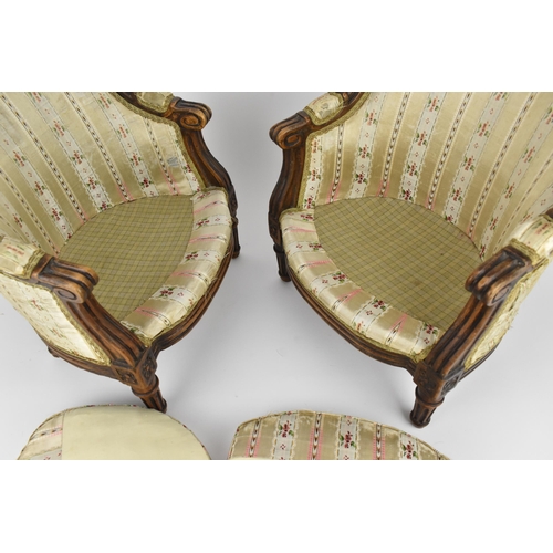 448 - A pair of 18th century French Louis XVI bergère armchairs, circa 1780, with channelled mahogany rail... 