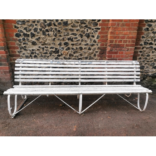 454 - A painted wood and wrought iron slatted garden bench, 87 cm high x 243 cm wide
Location: CON