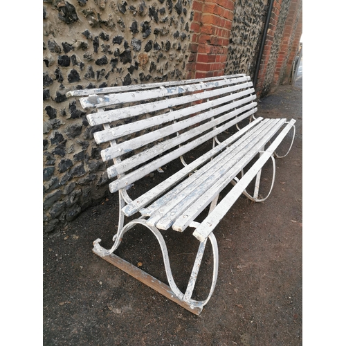 454 - A painted wood and wrought iron slatted garden bench, 87 cm high x 243 cm wide
Location: CON