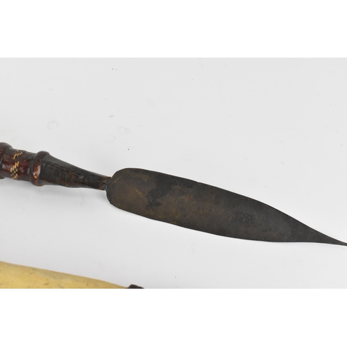 425 - African tribal weapons comprising hide bound hunting spear and smaller example, sword with similar h... 