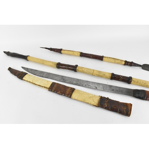 425 - African tribal weapons comprising hide bound hunting spear and smaller example, sword with similar h... 