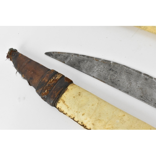 425 - African tribal weapons comprising hide bound hunting spear and smaller example, sword with similar h... 