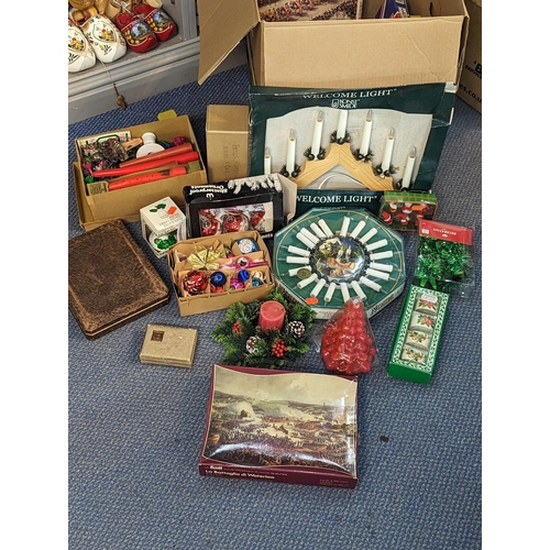 335 - A mixed lot to include jigsaw puzzles A/F and games along with Christmas decorations and other items... 