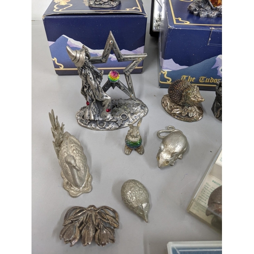 345 - A mixed lot to include two boxed Pewter ornaments to include the Unicorn of Justice, Dragon of Ice x... 