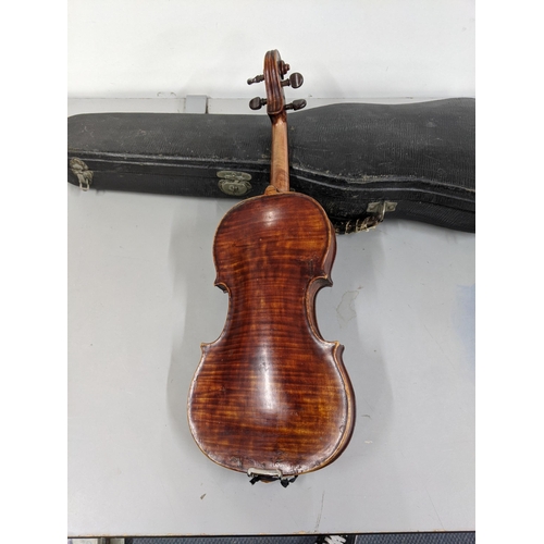 382 - A 19th/20th century violin with a one piece back, the bow with silver plated, ivory and mother of pe... 