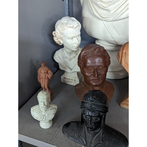 396 - A group of composition and other busts to include Apollo, King George V, Queen Elizabeth II, Winston... 