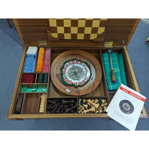 401 - An Italian Dal Negro games table having a burr walnut veneered top, with contents Location: A2B