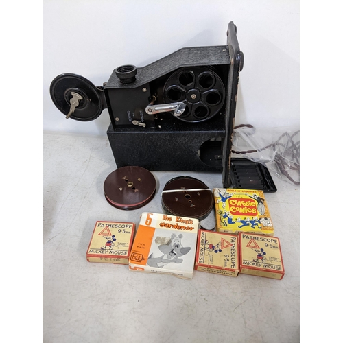 464 - A 1930's Pathescope projector and mixed films to include mickey Mouse and others
Location: LWM