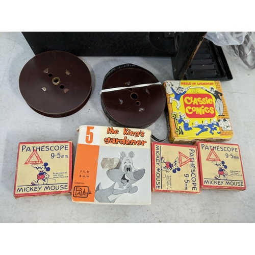 464 - A 1930's Pathescope projector and mixed films to include mickey Mouse and others
Location: LWM