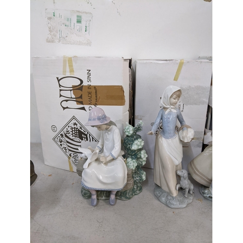 482 - Boxed Lladro and Nao ornaments to include a Lladro ornament of a dog entitled 'My Favourite Companio... 