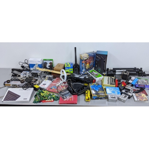 496 - Photographic equipment and game related items to include a wii guitar, tripod, TomTom, a watch and o... 