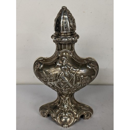 457 - A late 19th/early 20th century import Hanau silver sugar caster of classical form and embossed decor... 