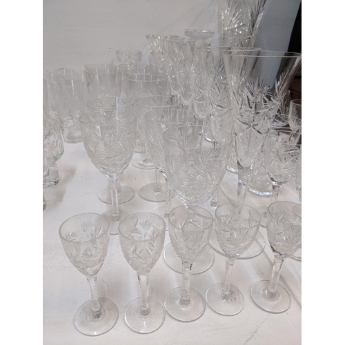 147 - Glass to include sets and part sets to include six champagne, wine glasses, decanter, candlesticks, ... 