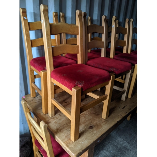 236 - A large pine rectangular topped dining table, 83cm h x 212cm w together with ten ladder back chairs
... 