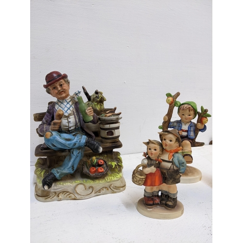 355 - A group of five Goebel Hummel figurines to include the Apple Tree Girl and Boy, Surprise A/F and oth... 