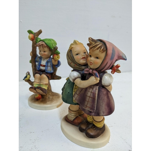 355 - A group of five Goebel Hummel figurines to include the Apple Tree Girl and Boy, Surprise A/F and oth... 