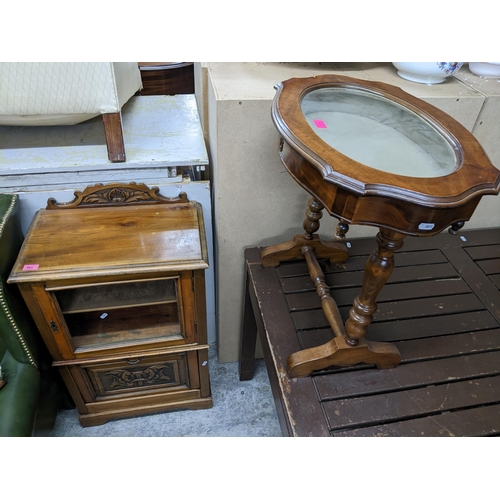 383 - A late Victorian walnut music cabinet, the carved and shaped extended back over a top with moulded e... 