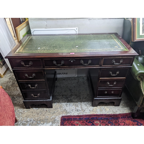 437 - A reproduction mahogany twist pedestal nine drawer desk, 77cm h x 121cm w
Location: G