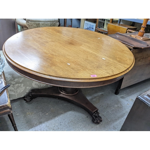 474 - An early 19th century mahogany tilt top breakfast table, circular top with moulded edge, supported o... 