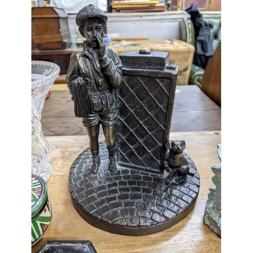 477 - A mixed lot to include an Irish bronze resin figure group of a newspaper boy and his dog, a Victoria... 