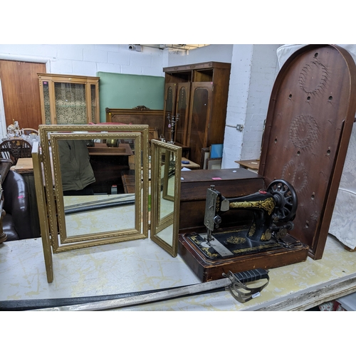 479 - A lot to include a wooden cased Singer sewing machine model 15k serial number F91644 c1910, a gilt f... 