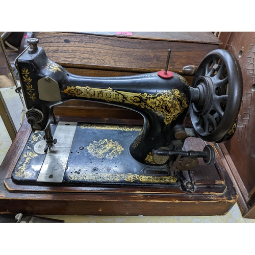 479 - A lot to include a wooden cased Singer sewing machine model 15k serial number F91644 c1910, a gilt f... 