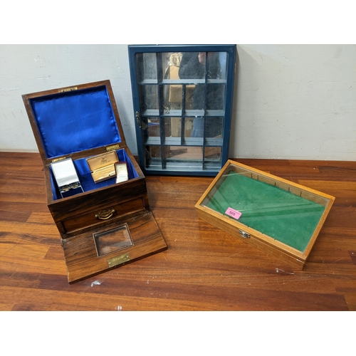 505 - An early 20th century walnut jewellery box with a glaze full front, a collectors cabinet and a table... 