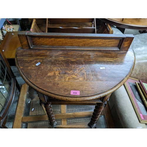 432 - A 1930's demi lune oak hall table with barley twist legs, 81cm h x 70cm w
Location: G