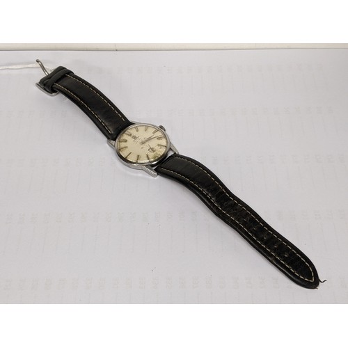 76 - An Omega, manual winding gents stainless steel wristwatch, having a textured dial with subsidiary se... 