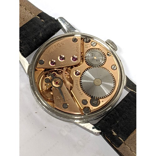 76 - An Omega, manual winding gents stainless steel wristwatch, having a textured dial with subsidiary se... 