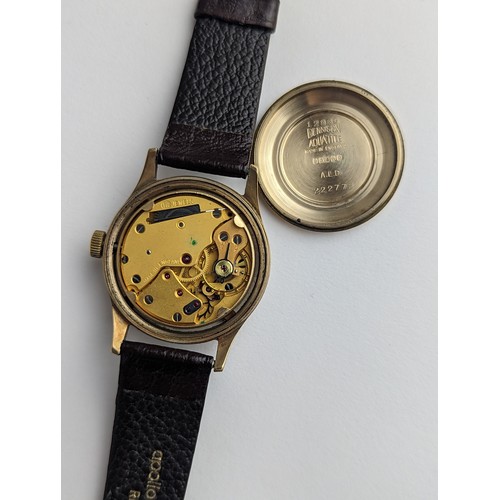 64 - A Garrard gents 9ct gold cased manual wind wristwatch, having a silvered dial with Arabic numerals, ... 