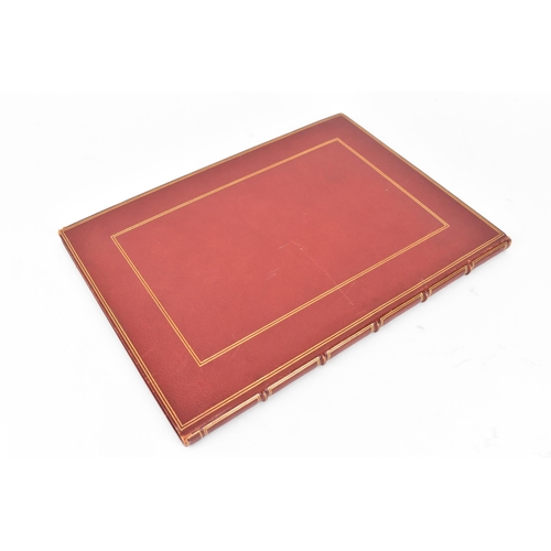 196 - An early 20th century tooled leather bound commemorative book, to honour the fifty year service of M... 