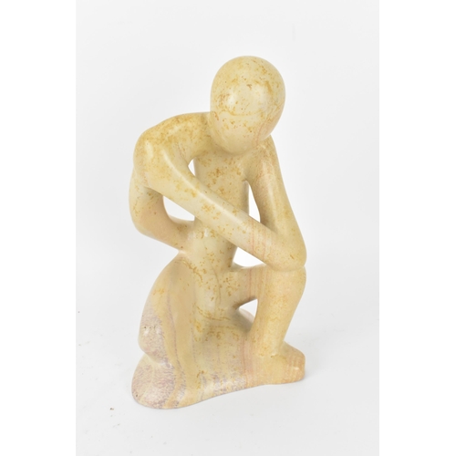 203 - Two African soapstone figural sculptures, one modelled as a man holding his foot to his head, the ot... 