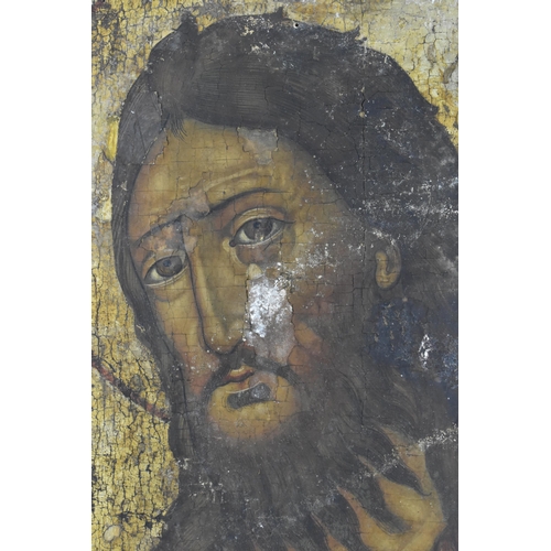 207 - A 19th Century Russian painted icon, possibly of Saint John the Baptist, tempera on wooden panel, wi... 
