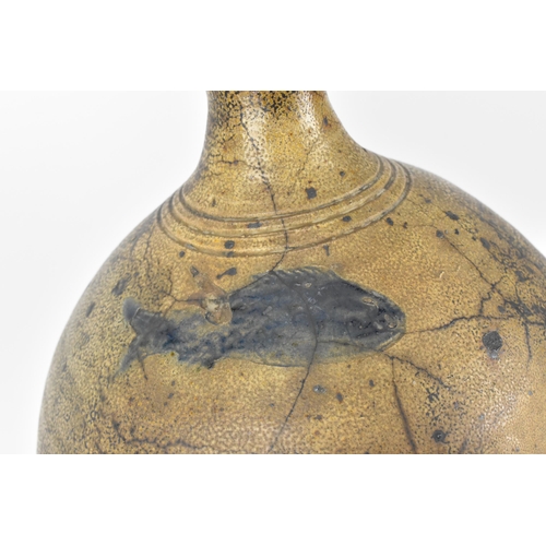 209 - A German salt-glazed stoneware flagon, with engraved and blue painted fish to the front, 41 cm high ... 