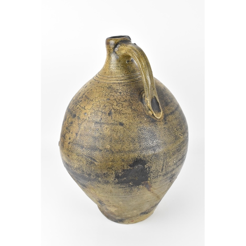 209 - A German salt-glazed stoneware flagon, with engraved and blue painted fish to the front, 41 cm high ... 