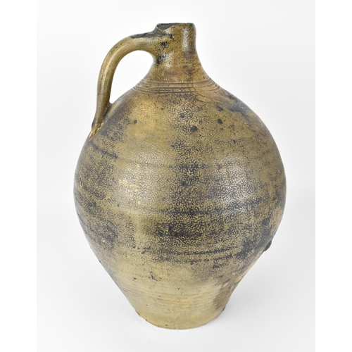 209 - A German salt-glazed stoneware flagon, with engraved and blue painted fish to the front, 41 cm high ... 