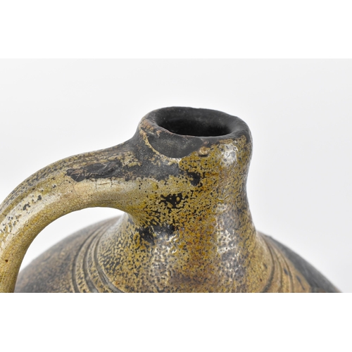 209 - A German salt-glazed stoneware flagon, with engraved and blue painted fish to the front, 41 cm high ... 