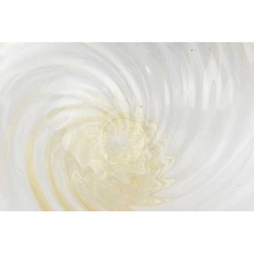 219 - An Italian Murano glass bowl designed by Archimede Seguso, circa 1970, the clear wrythen pattern wit... 