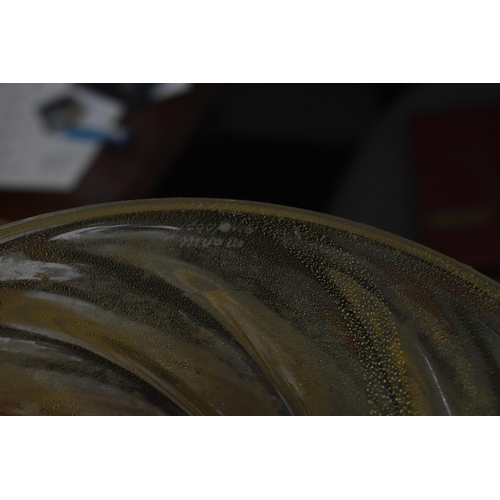 219 - An Italian Murano glass bowl designed by Archimede Seguso, circa 1970, the clear wrythen pattern wit... 