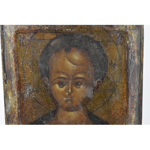 224 - A 19th century Russian icon of Christ, with Cyrillic letters either side of his halo, tempura on pan... 