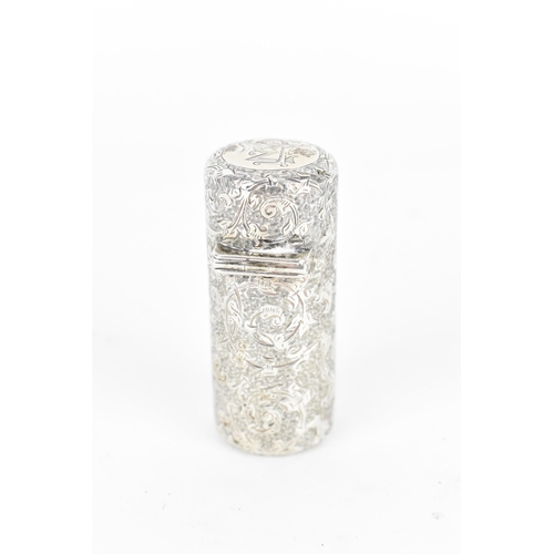 225 - A Victorian silver snuff bottle by Sampson Mordan & Co, with engraved foliate work throughout, with ... 