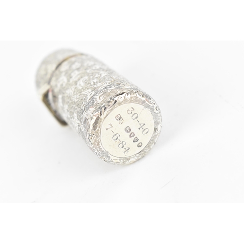 225 - A Victorian silver snuff bottle by Sampson Mordan & Co, with engraved foliate work throughout, with ... 