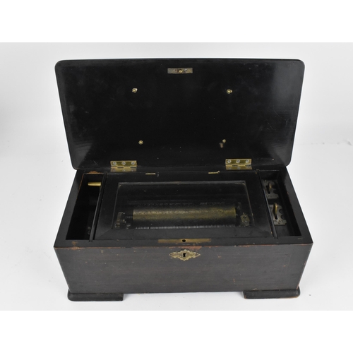 234 - A Victorian rosewood cylinder music box, the lid inlaid with stringing and central marquetry decorat... 